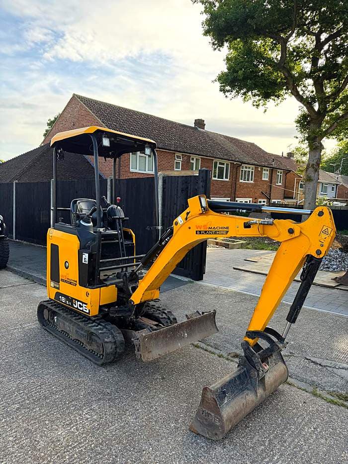 WS Machine mini excavator on a residential driveway